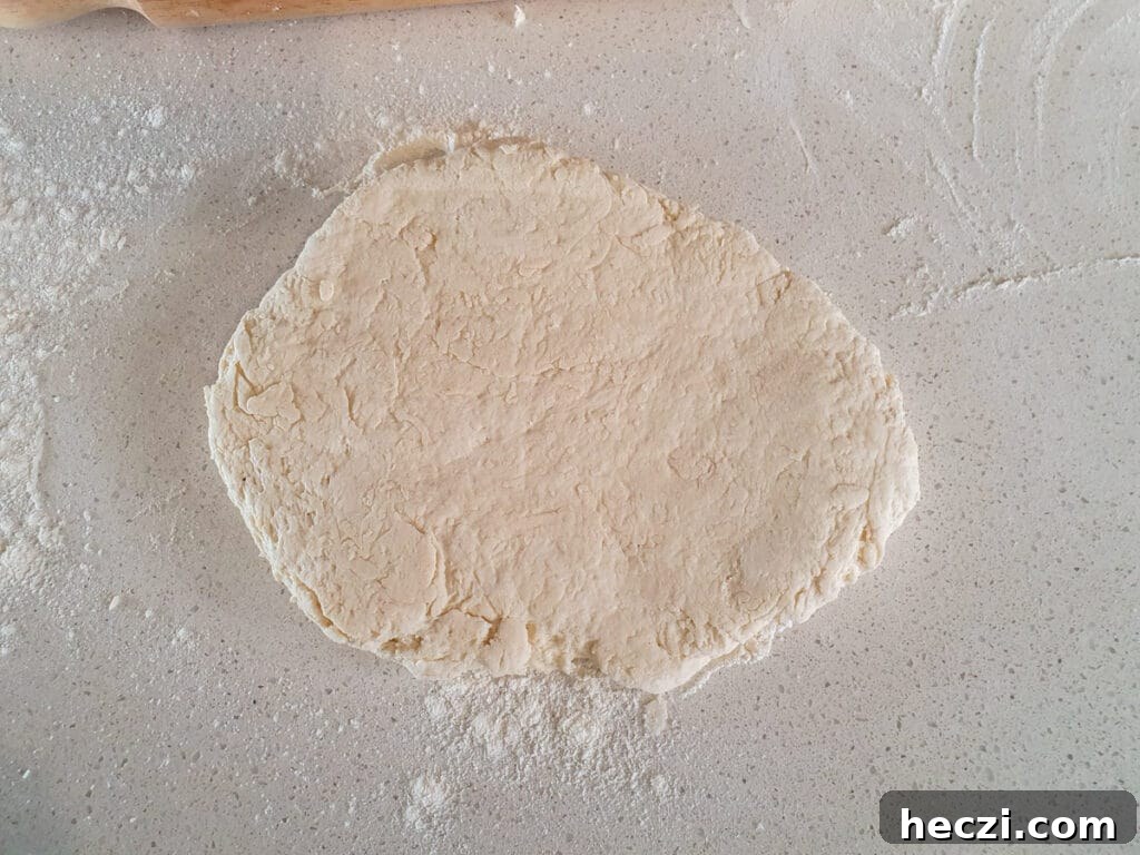 Air Fryer Cinnamon Rolls: Quick, Fluffy Homemade Recipe 6 Starting to roll out dough before picking up, re flouring and flipping.