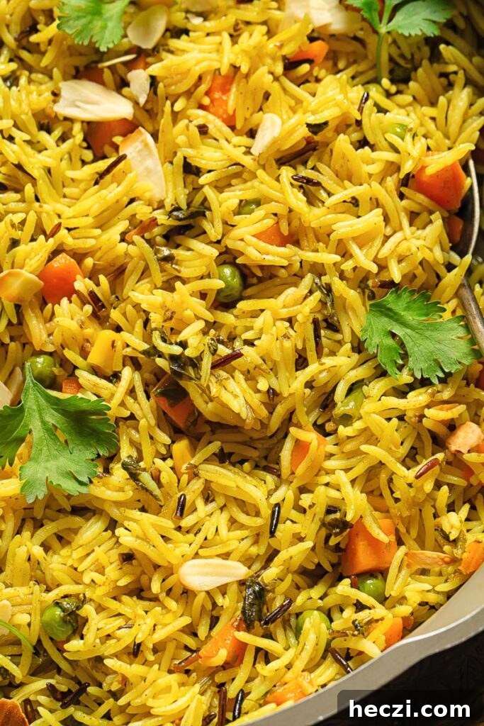Basmati and Wild Rice Pilaf with Roasted Vegetables 3 Close up of pilaf with peas, carrots and cilantro
