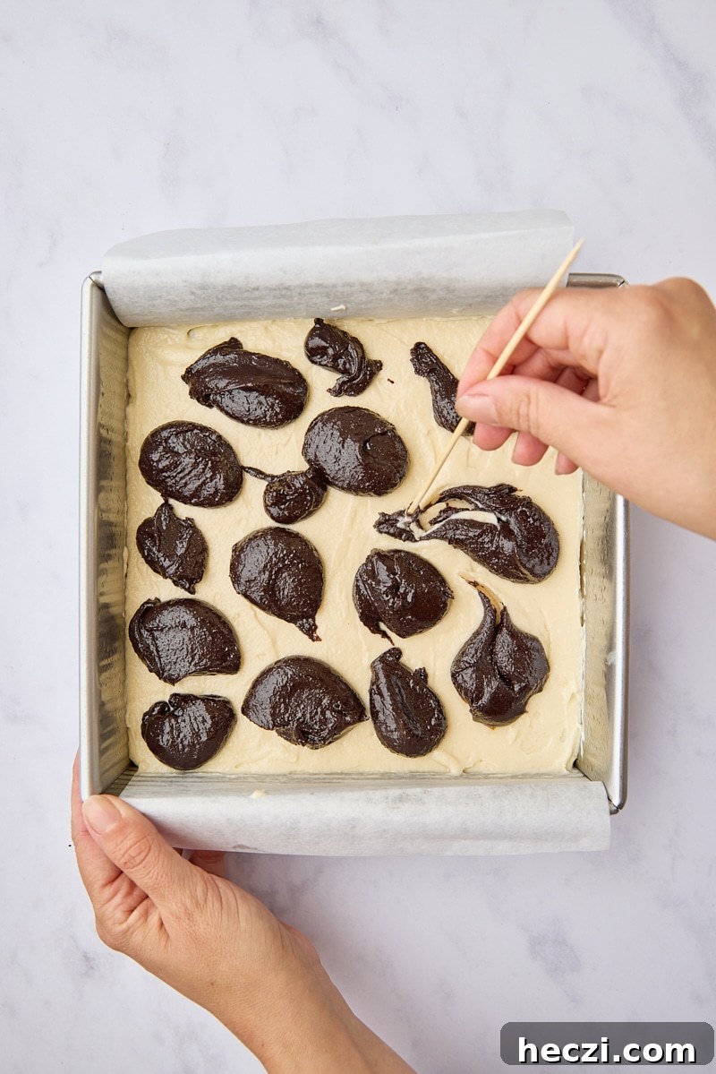 Fudgy Brownies with Cream Cheese Swirl Recipe 8 Dollops of brownie batter over cream cheese layer