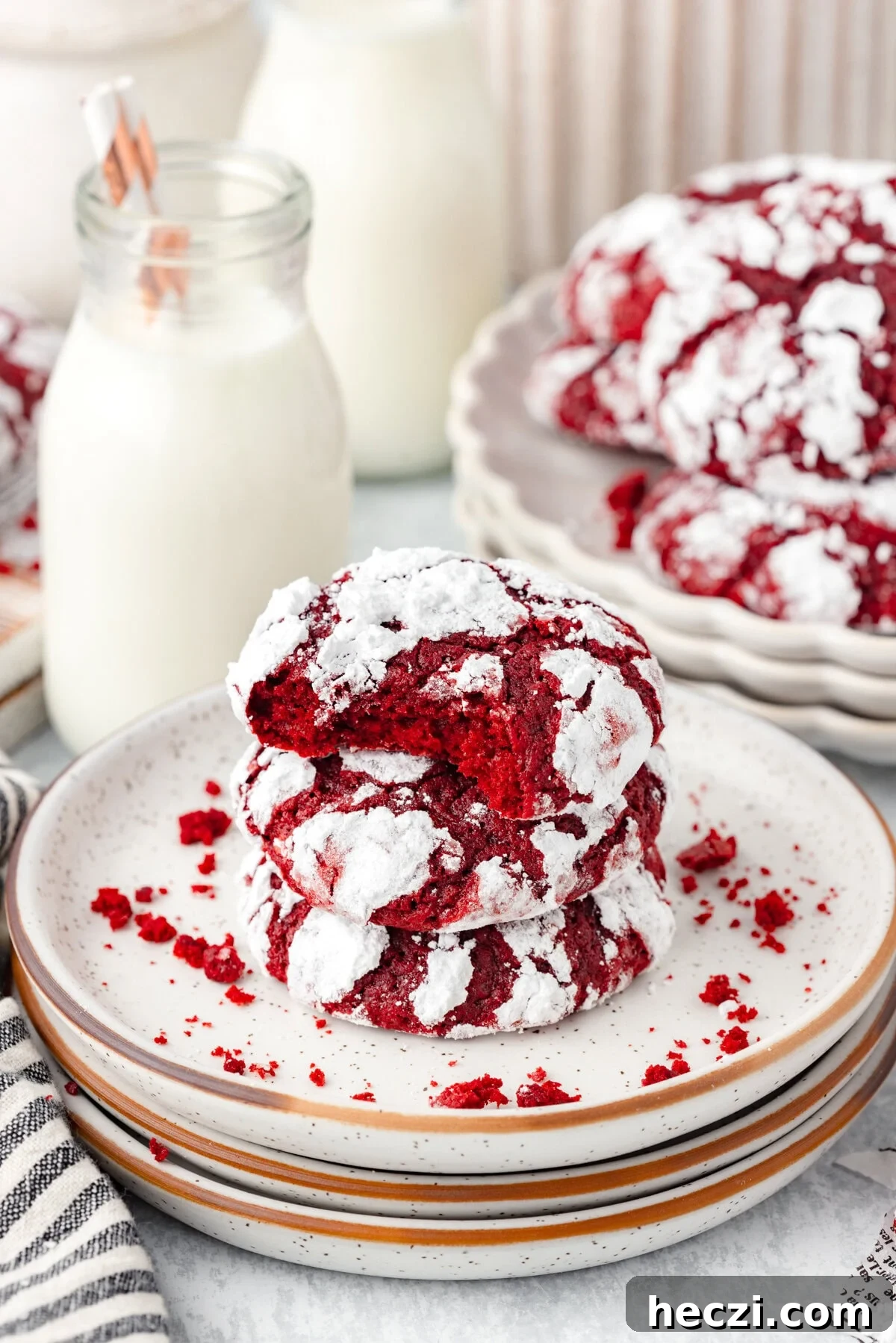 Red Velvet Crinkle Cookies: Soft, Fudgy Holiday Recipe 2 Cream cheese cookies with red velvet appearance on a decorated plate.