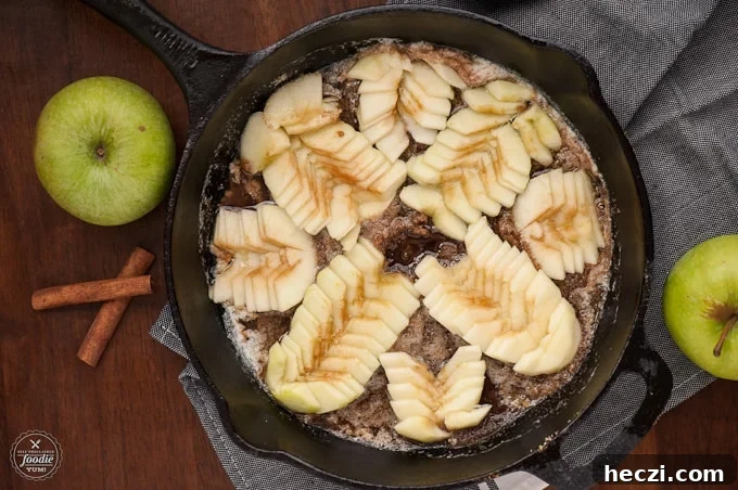 Caramel Apple Upside-Down Cake Recipe for Fall Gatherings 3 apples in cast iron skillet for apple cake recipe