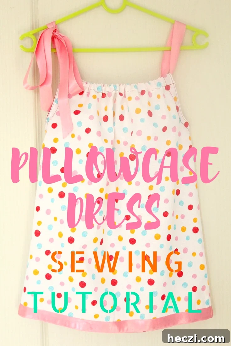 Pillowcase dress in polka dots with pink ribbon ties