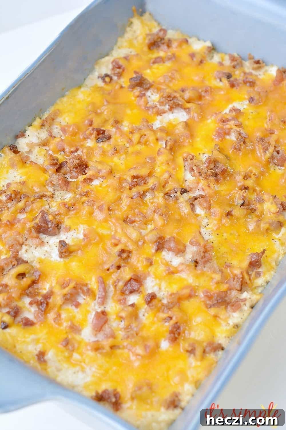 keto cauliflower casserole keto chicken bacon ranch casserole in pan. 