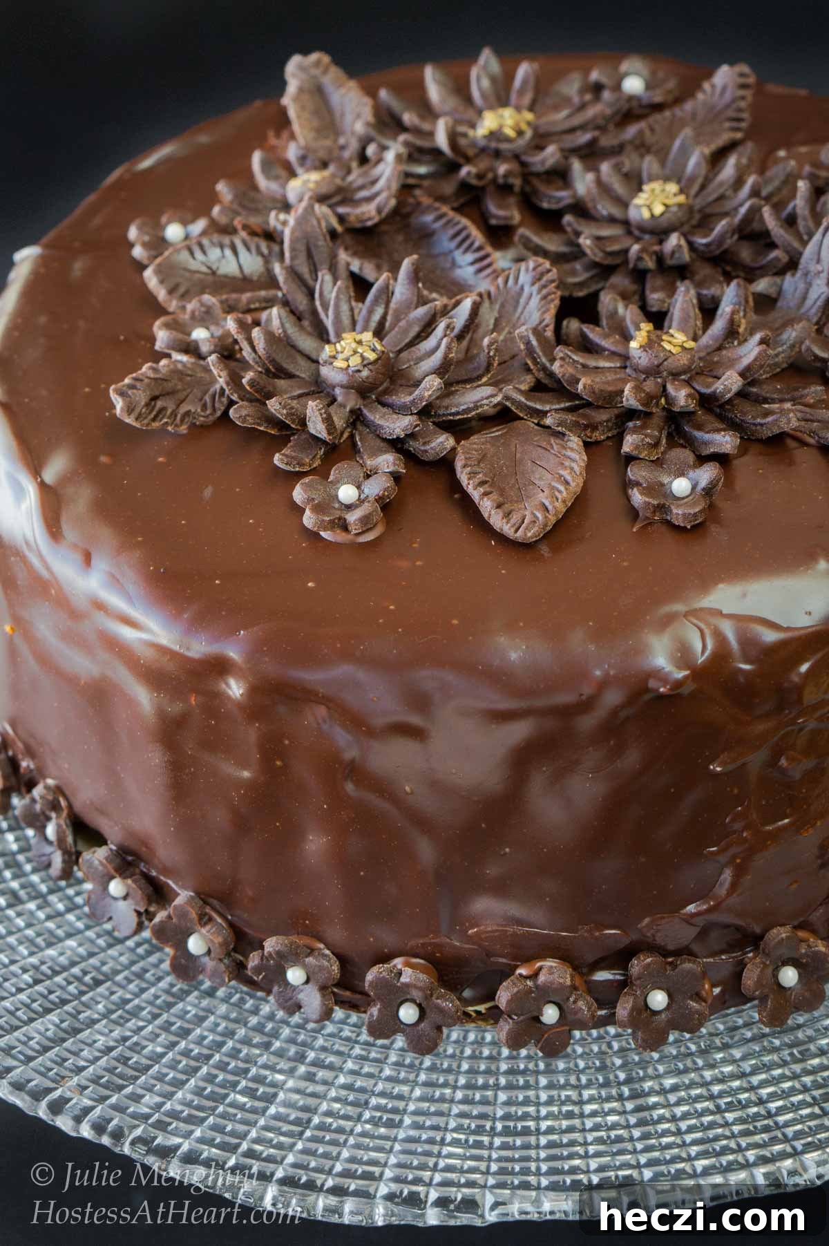 Black Russian Cake with Kahlúa Recipe: Rich Chocolate Cocktail Dessert 4 Beautiful round chocolate cake with a shiny ganache decorated with chocolate flowers.