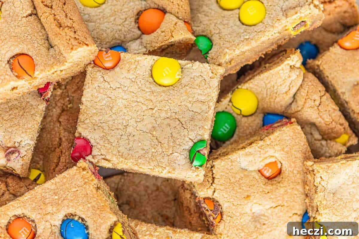 A pile of blondies with M&Ms.