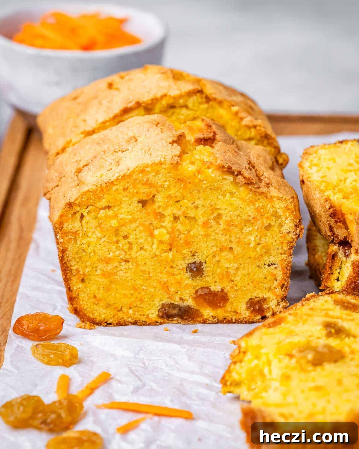 Extra-Moist Carrot Cake Loaf Recipe Packed with Flavor 2 Close-up of sliced carrot cake loaf sliced, showing its golden color and moist interior.