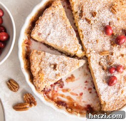 nantucket pie in tart pan with two slices cut.
